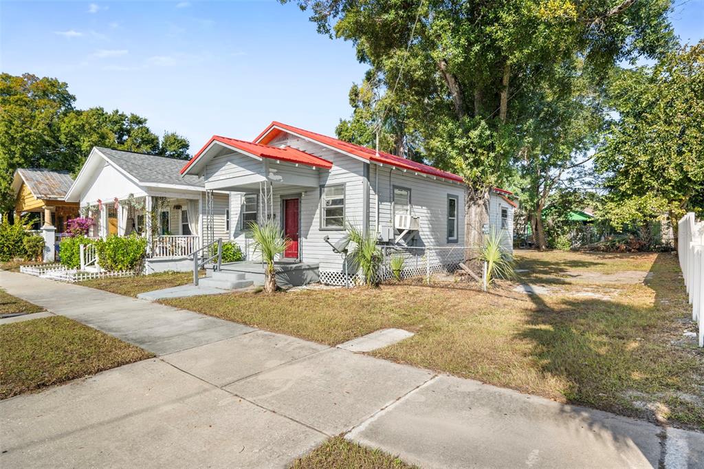 2119 West Chestnut Street Tampa, FL 33607 - Photo 2 of 33 a front view of a house with yard porch and outdoor seating