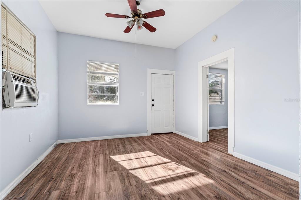 2119 West Chestnut Street Tampa, FL 33607 - Photo 6 of 33 a view of a room with wooden floor and white walls