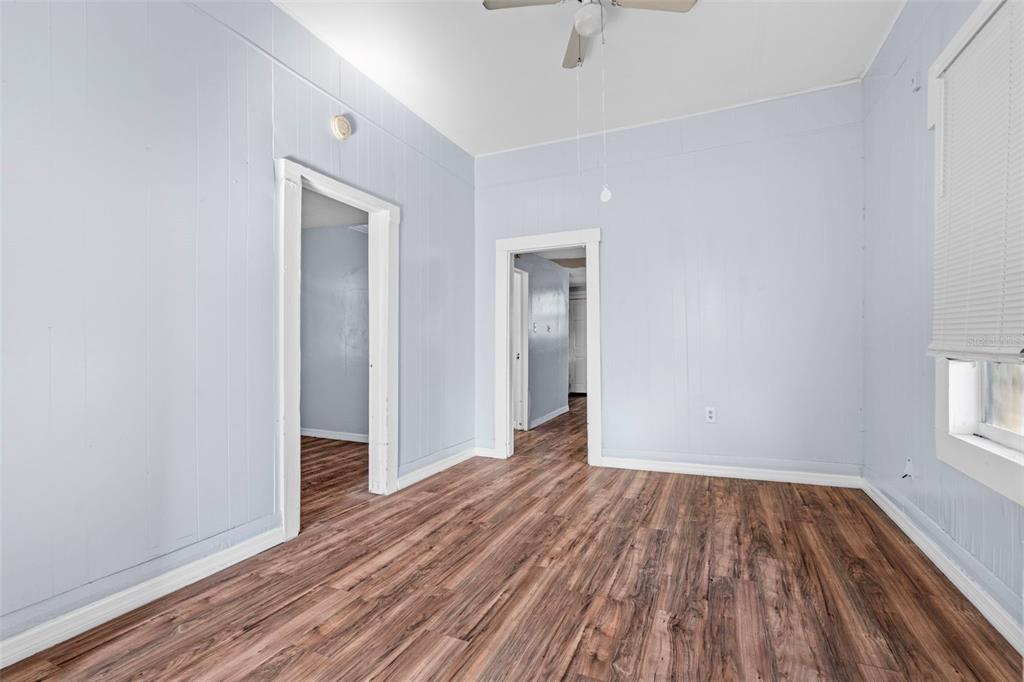 2119 West Chestnut Street Tampa, FL 33607 - Photo 7 of 33 wooden floor in an empty room with a window
