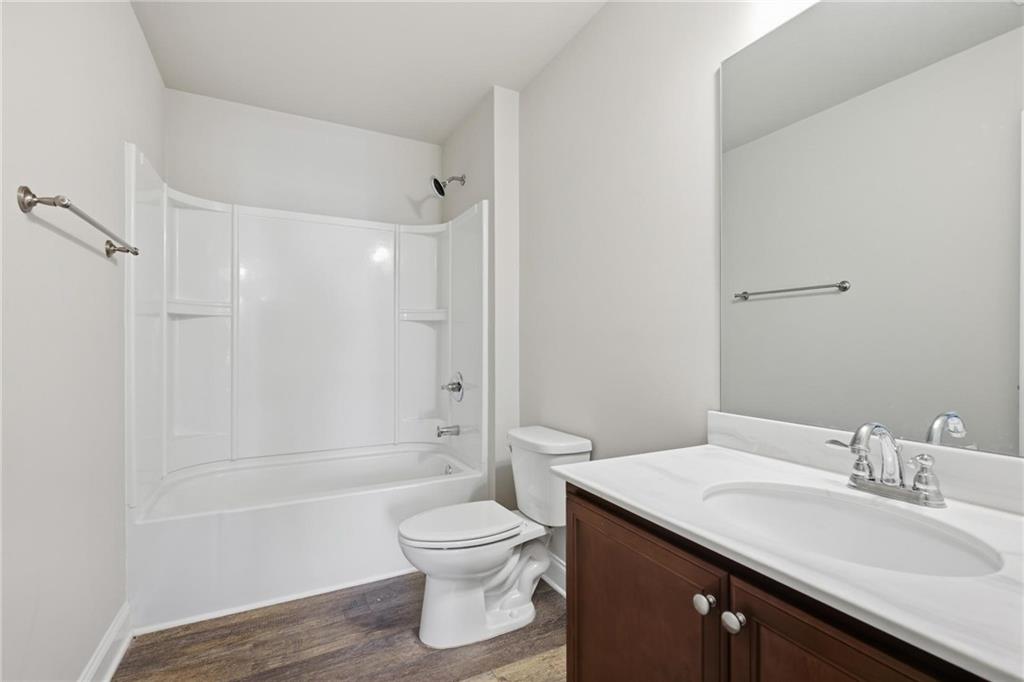 47 Violet Lane Dallas, GA 30132 - Photo 22 of 27 a bathroom with a sink toilet and shower