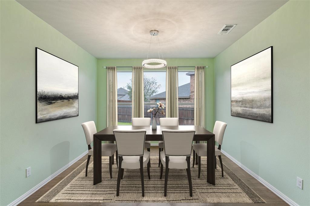 6518 Dry Farm Rowlett, TX 75089 - Photo 16 of 40 a dining room with furniture a chandelier and wooden floor