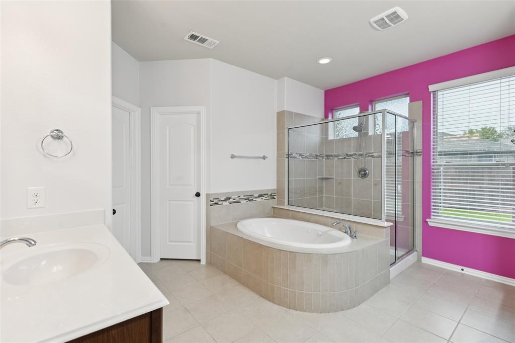 6518 Dry Farm Rowlett, TX 75089 - Photo 22 of 40 a bathroom with a tub sink and mirror