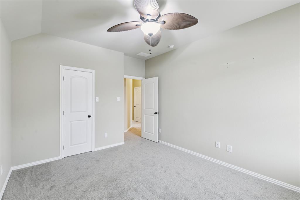 6518 Dry Farm Rowlett, TX 75089 - Photo 36 of 40 a view of an empty room and chandelier fan