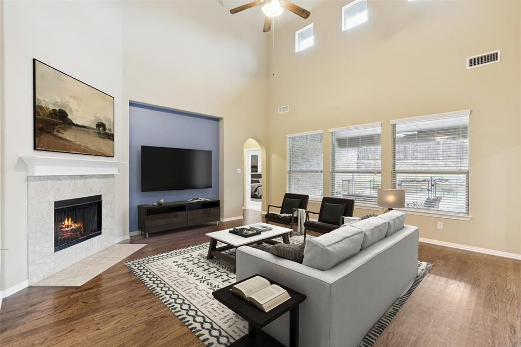 6518 Dry Farm Rowlett, TX 75089 - Photo 6 of 40 a living room with furniture a flat screen tv and a fireplace