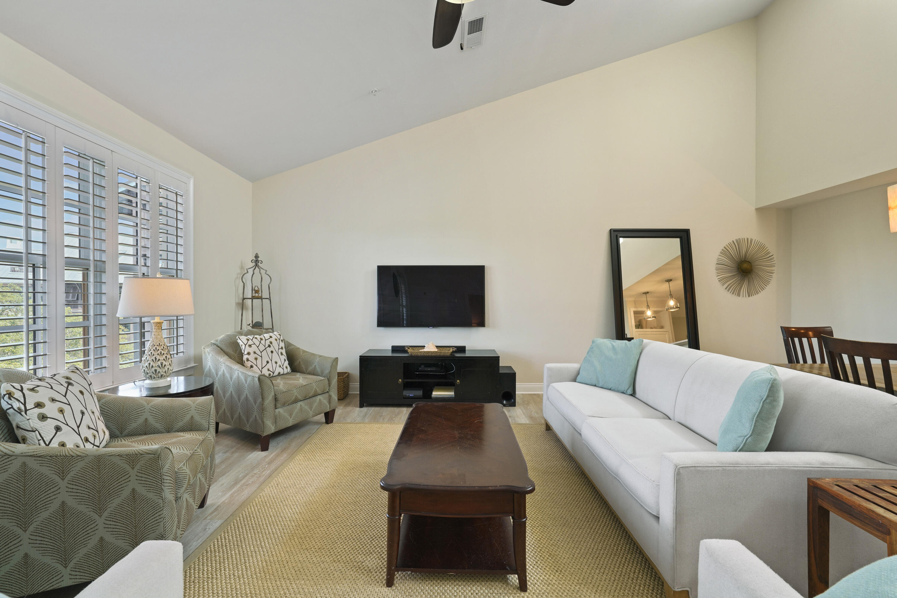 34 North Barrett Square, Unit 3A Inlet Beach, FL 32461 - Photo 16 of 45 a living room with furniture and a flat screen tv