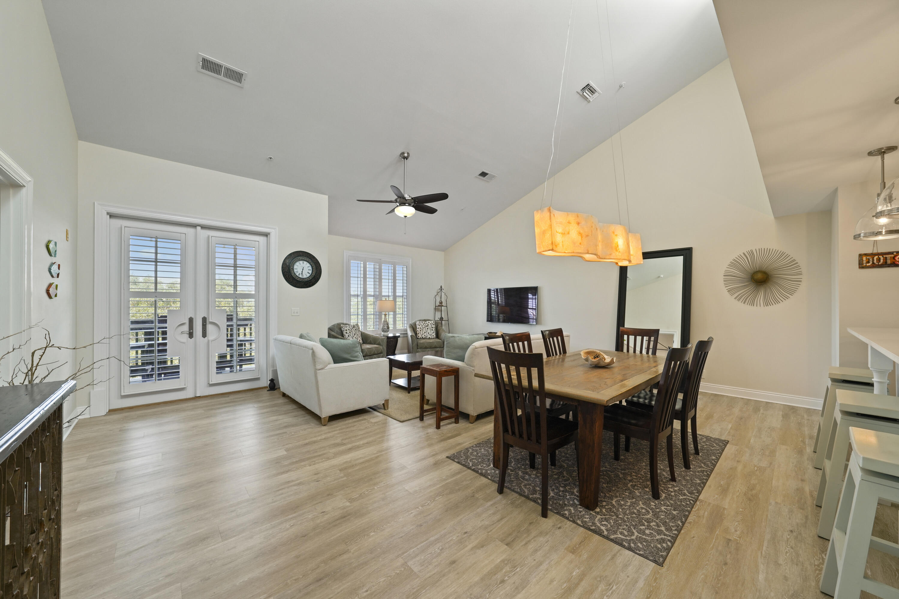 34 North Barrett Square, Unit 3A Inlet Beach, FL 32461 - Photo 18 of 45 a view of a dining room with furniture and wooden floor