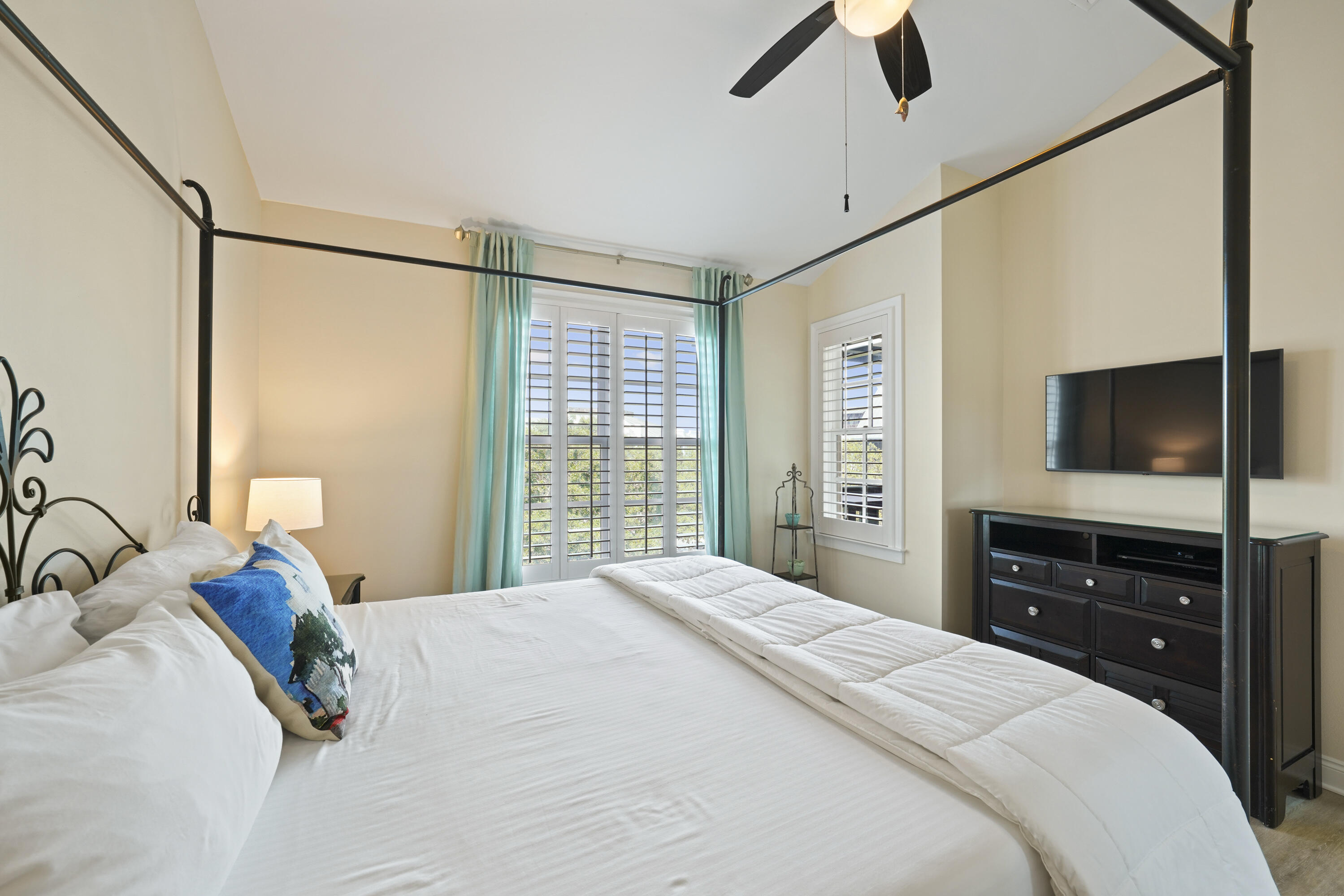 34 North Barrett Square, Unit 3A Inlet Beach, FL 32461 - Photo 19 of 45 a bedroom with a large bed and a flat tv screen