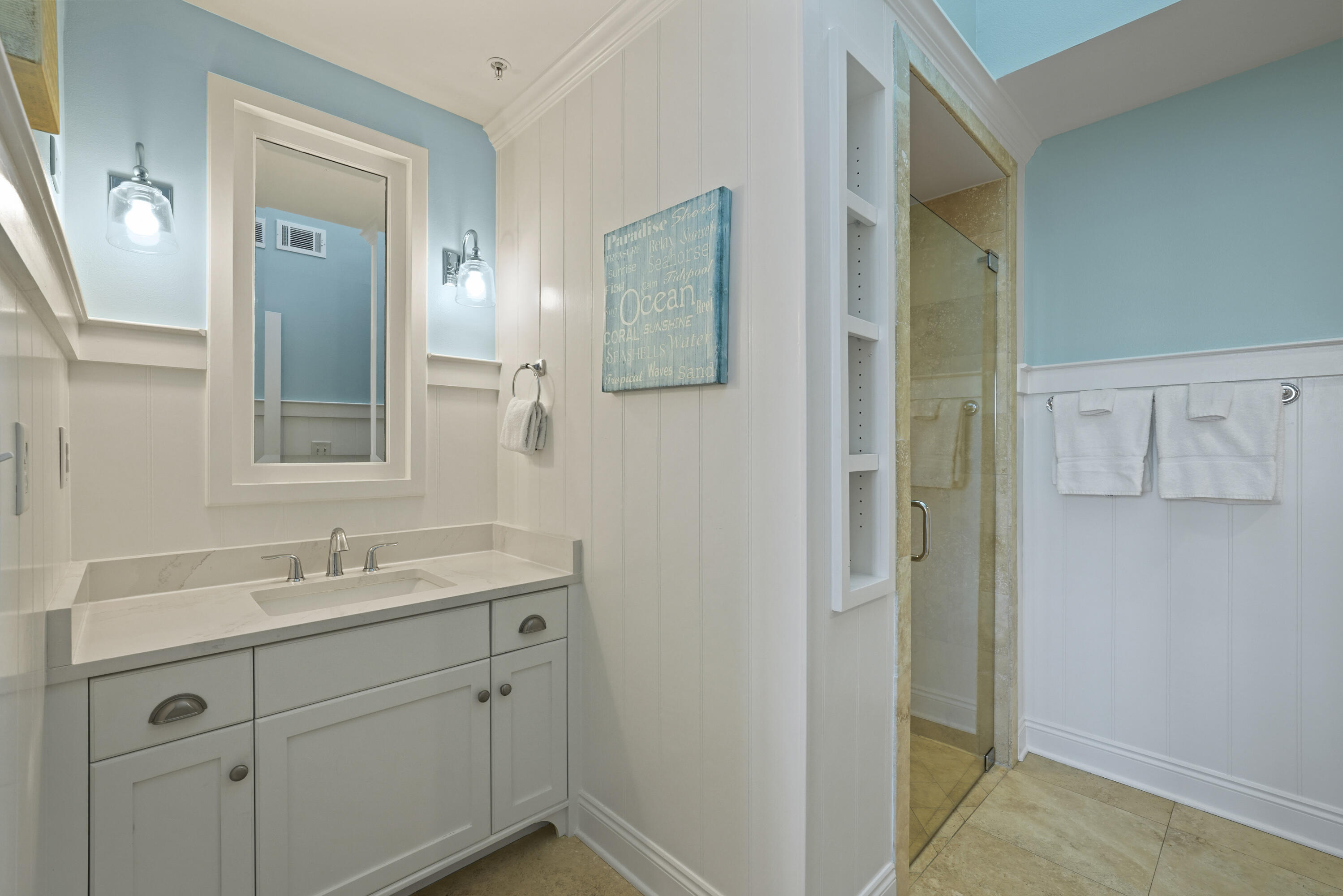 34 North Barrett Square, Unit 3A Inlet Beach, FL 32461 - Photo 22 of 45 a bathroom with a sink and mirror