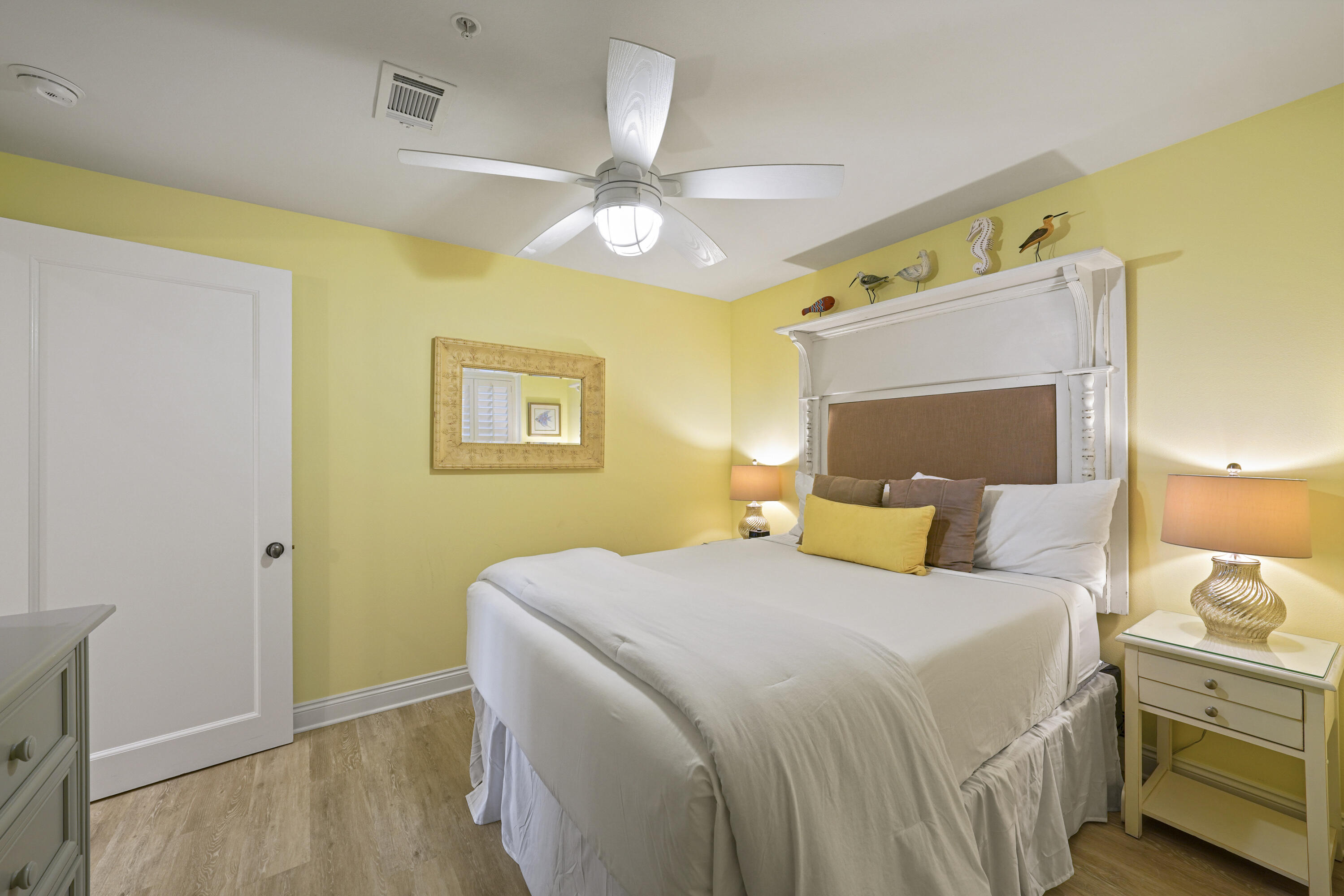 34 North Barrett Square, Unit 3A Inlet Beach, FL 32461 - Photo 25 of 45 a bedroom with a bed and a chandelier
