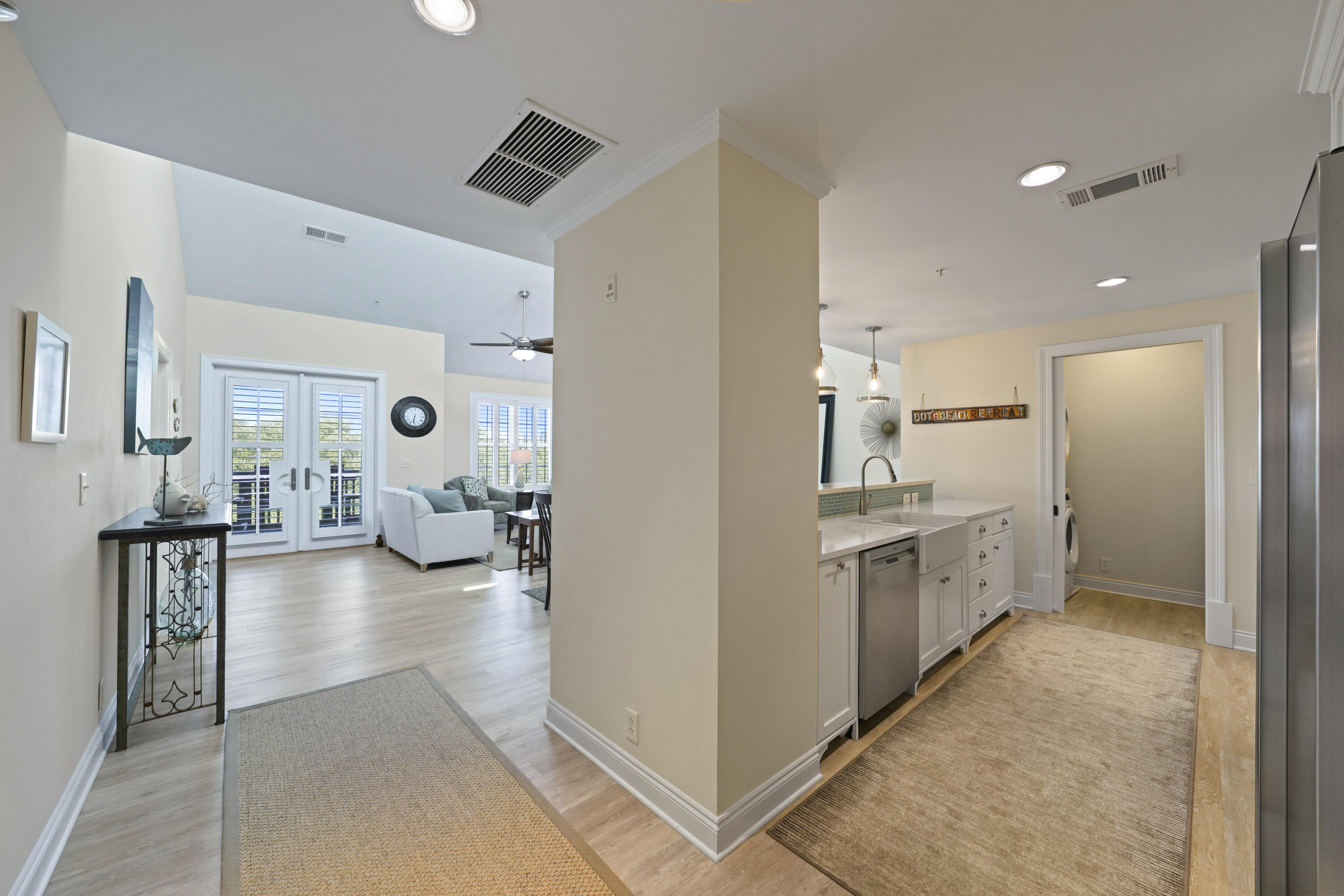 34 North Barrett Square, Unit 3A Inlet Beach, FL 32461 - Photo 27 of 45 a view of a kitchen center island and living room