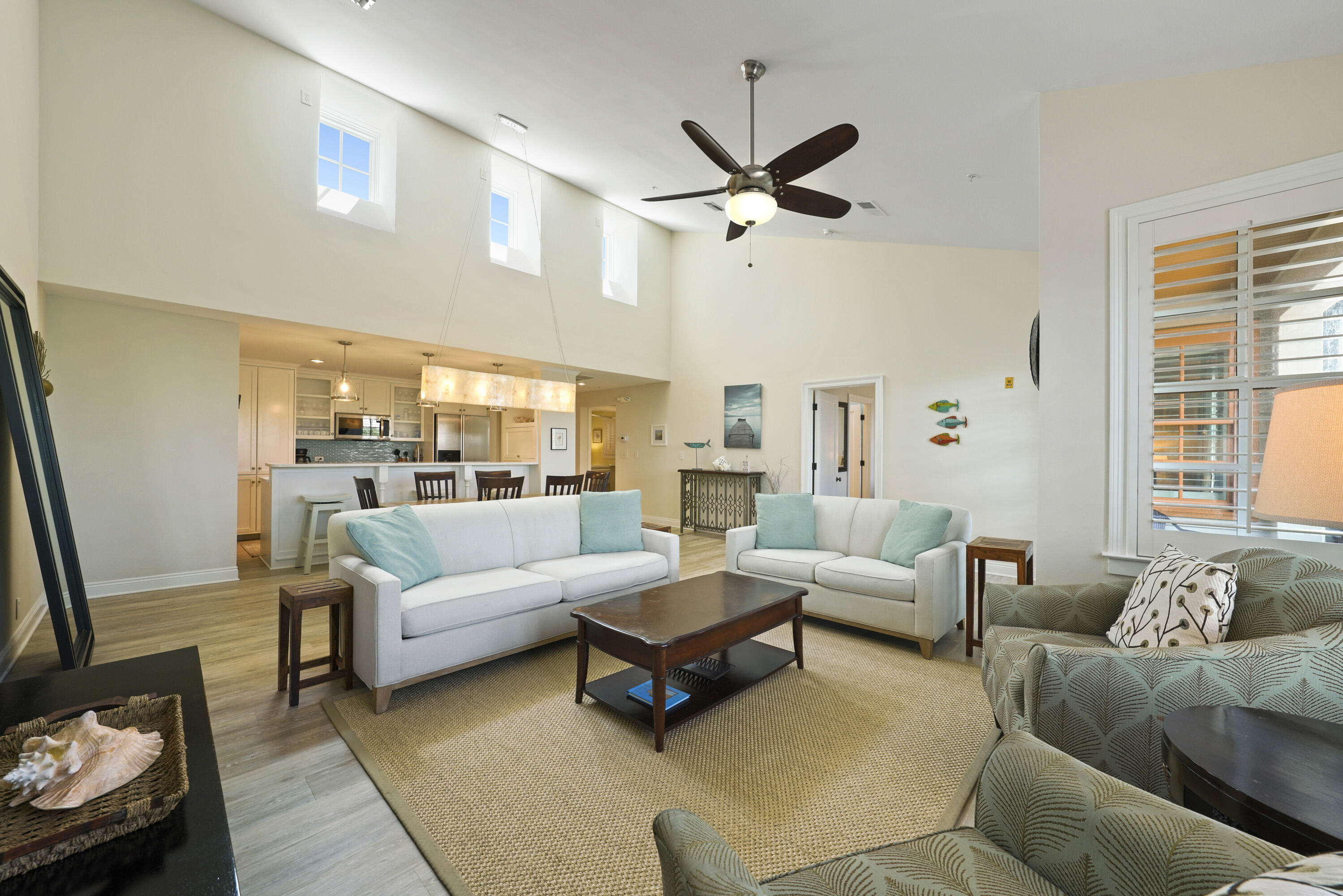 34 North Barrett Square, Unit 3A Inlet Beach, FL 32461 - Photo 4 of 45 a living room with furniture and a large window