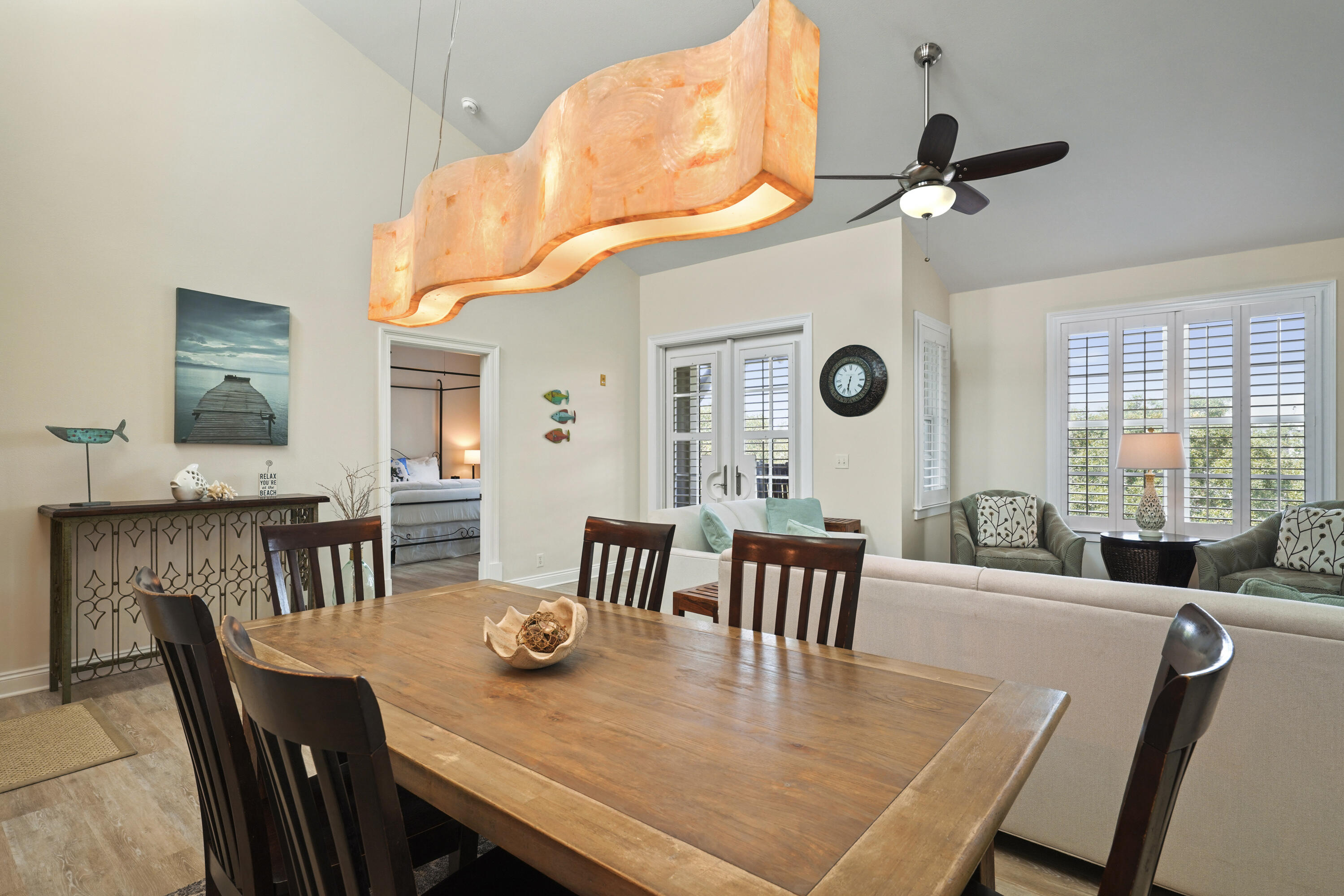 34 North Barrett Square, Unit 3A Inlet Beach, FL 32461 - Photo 5 of 45 a dining room with furniture a window and wooden floor