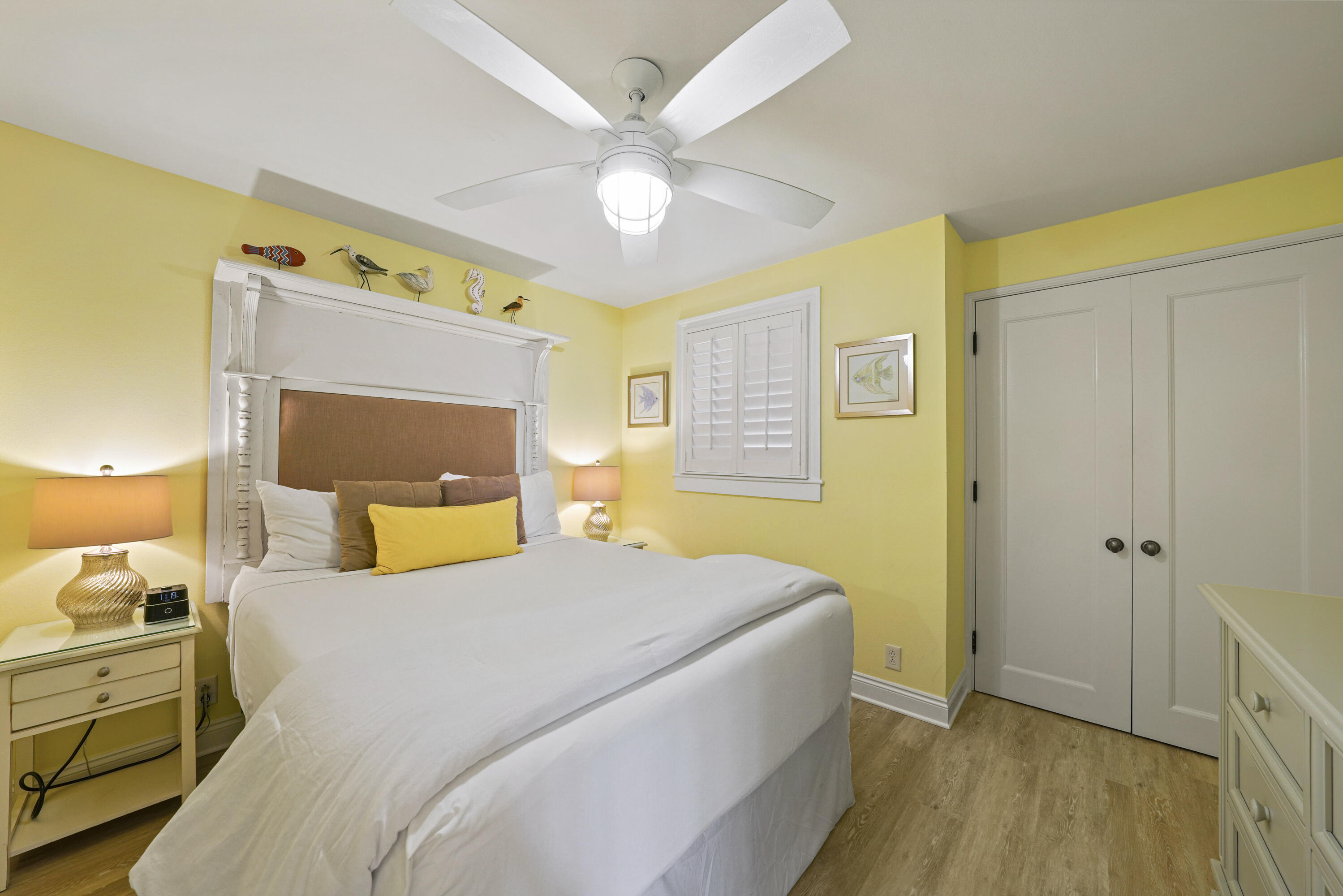 34 North Barrett Square, Unit 3A Inlet Beach, FL 32461 - Photo 7 of 45 a bedroom with a bed and a chandelier