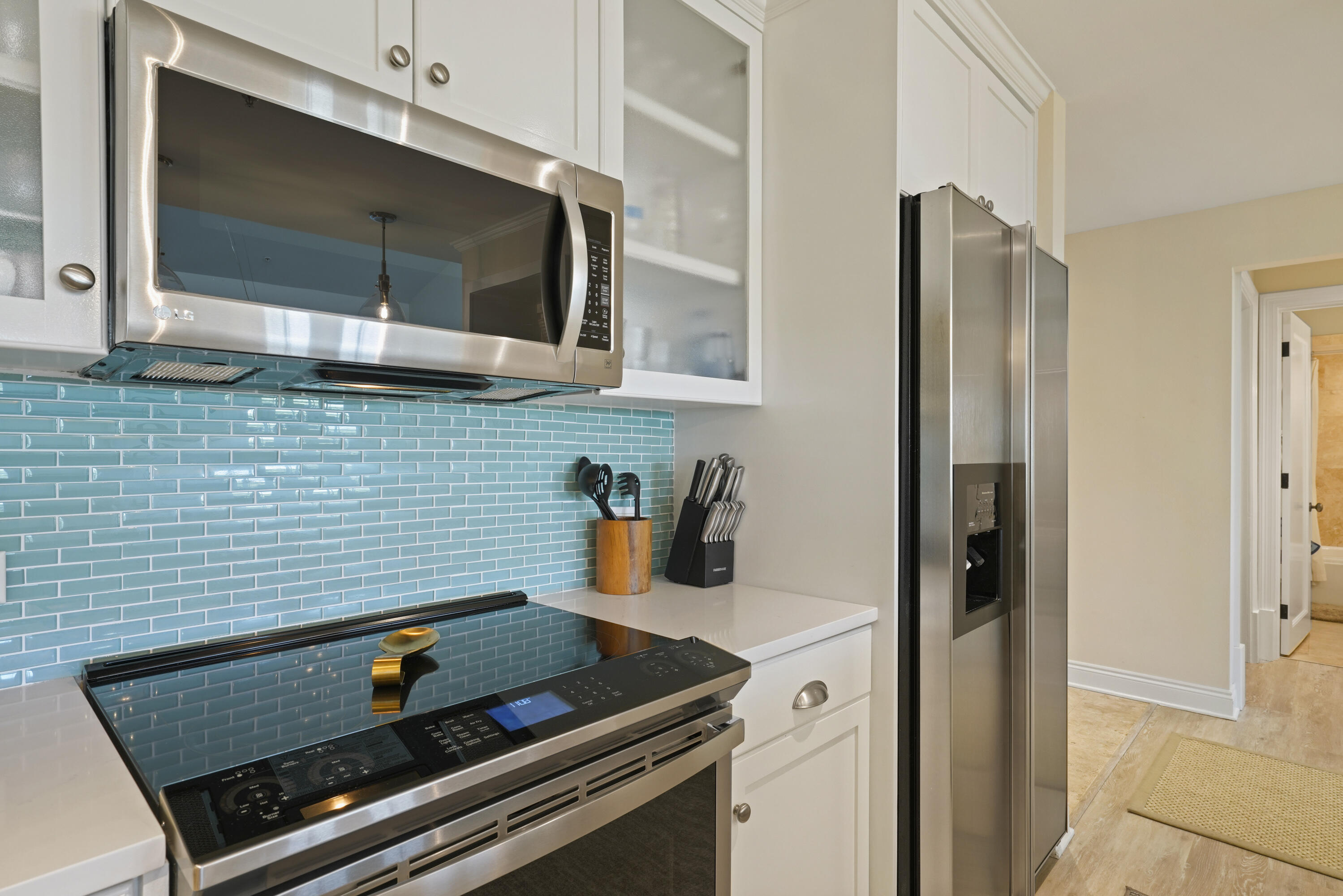 34 North Barrett Square, Unit 3A Inlet Beach, FL 32461 - Photo 10 of 45 a kitchen with a stove and a microwave