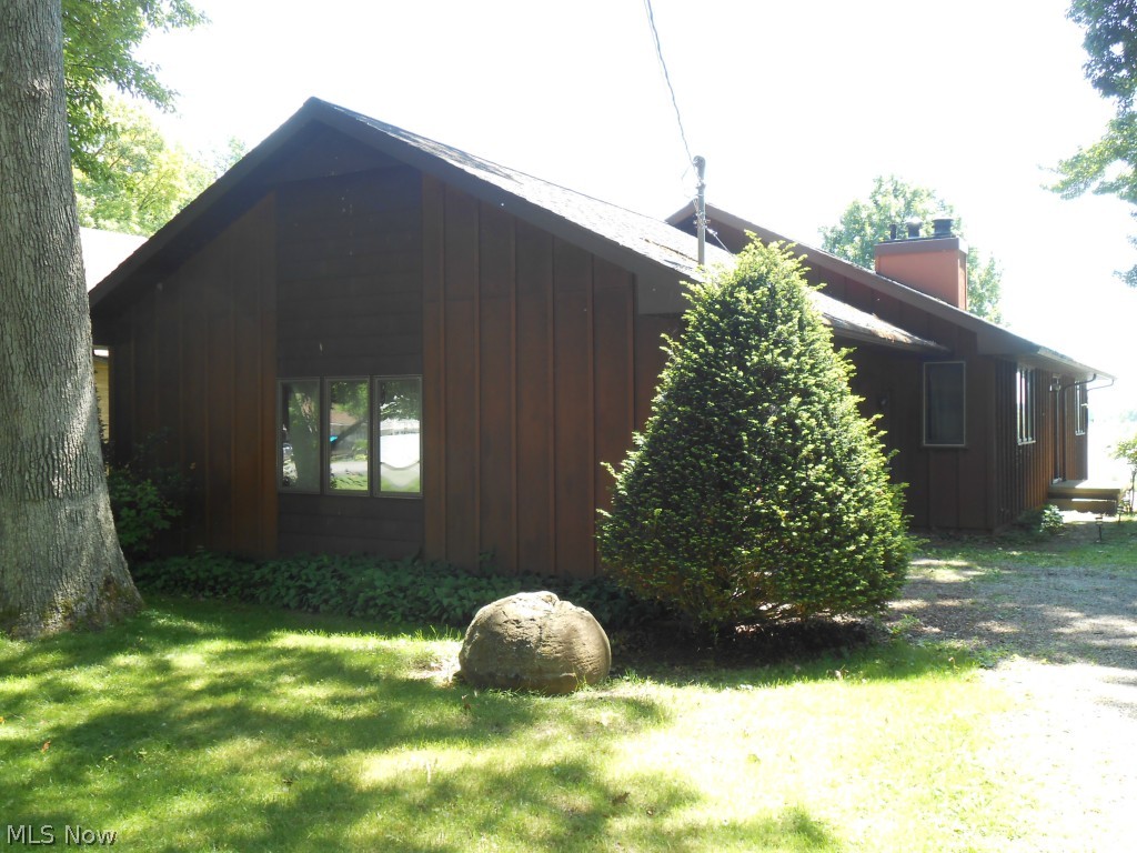 1234 Riverside Drive Huron, OH 44839 - Photo 1 of 25 Front of home facing road. Gravel driveway.