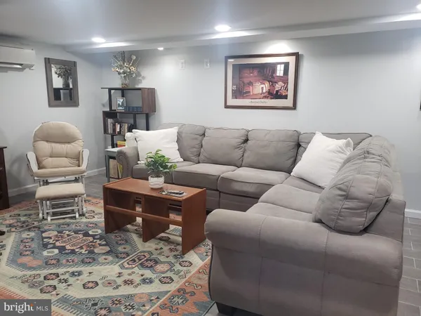 a living room with furniture or couch and a dining table