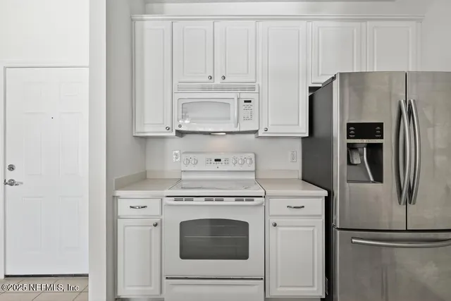a bathroom with a toilet a sink and a mirror