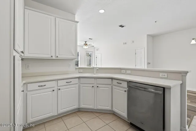 a view of a street with cars on city street