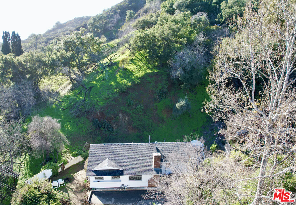 2485 Benedict Canyon Drive Beverly Hills, CA 90210 - Photo 4 of 33 an aerial view of house with yard and parking space