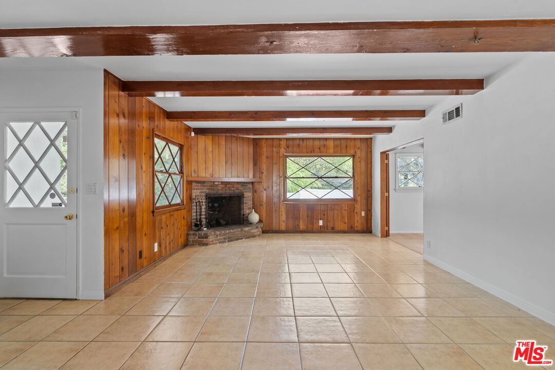 2485 Benedict Canyon Drive Beverly Hills, CA 90210 - Photo 6 of 33 a view of a livingroom with a staircase