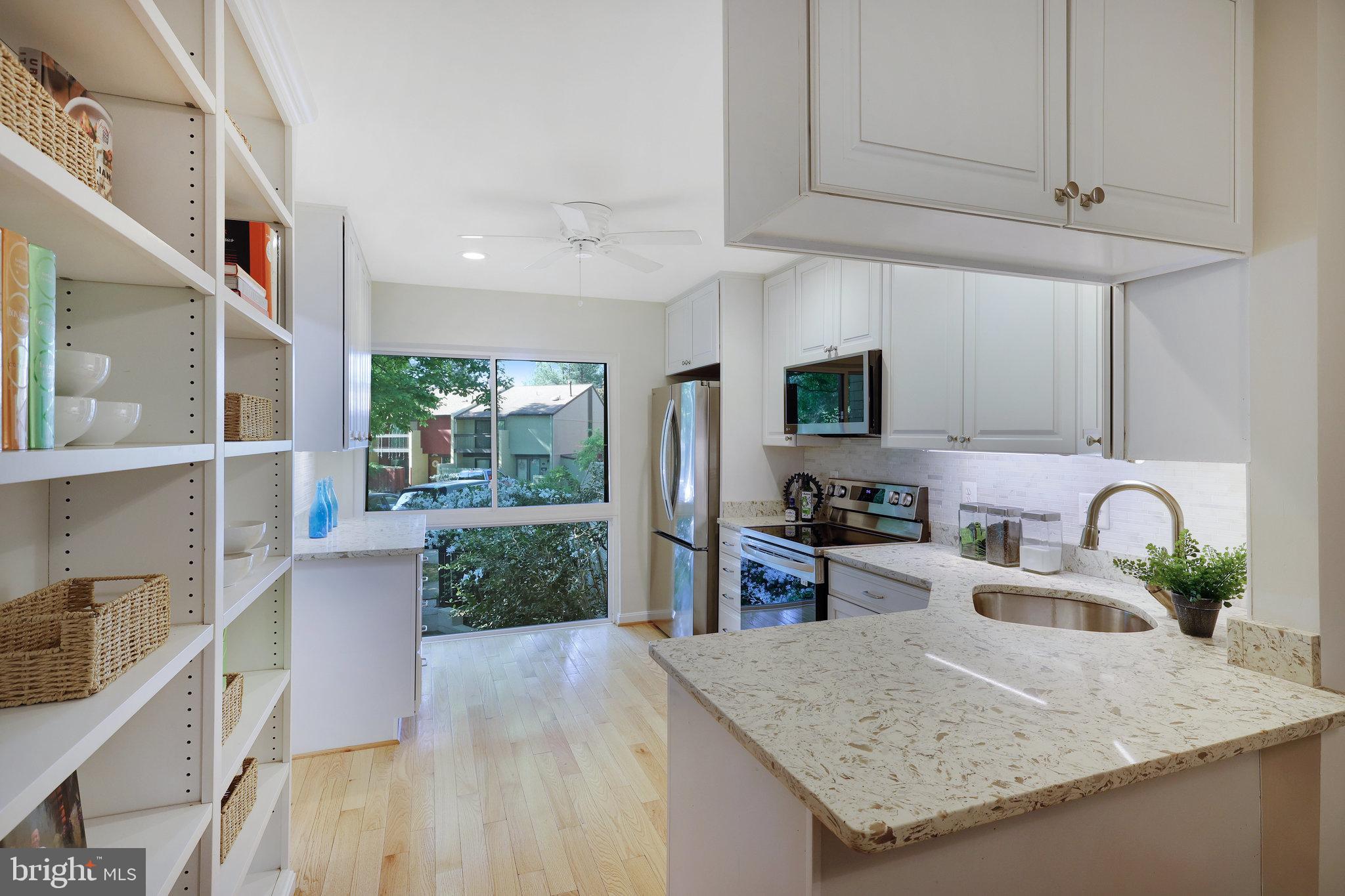 11128 Saffold Way Reston, VA 20190 - Photo 9 of 58 Kitchen with Built-In shelves