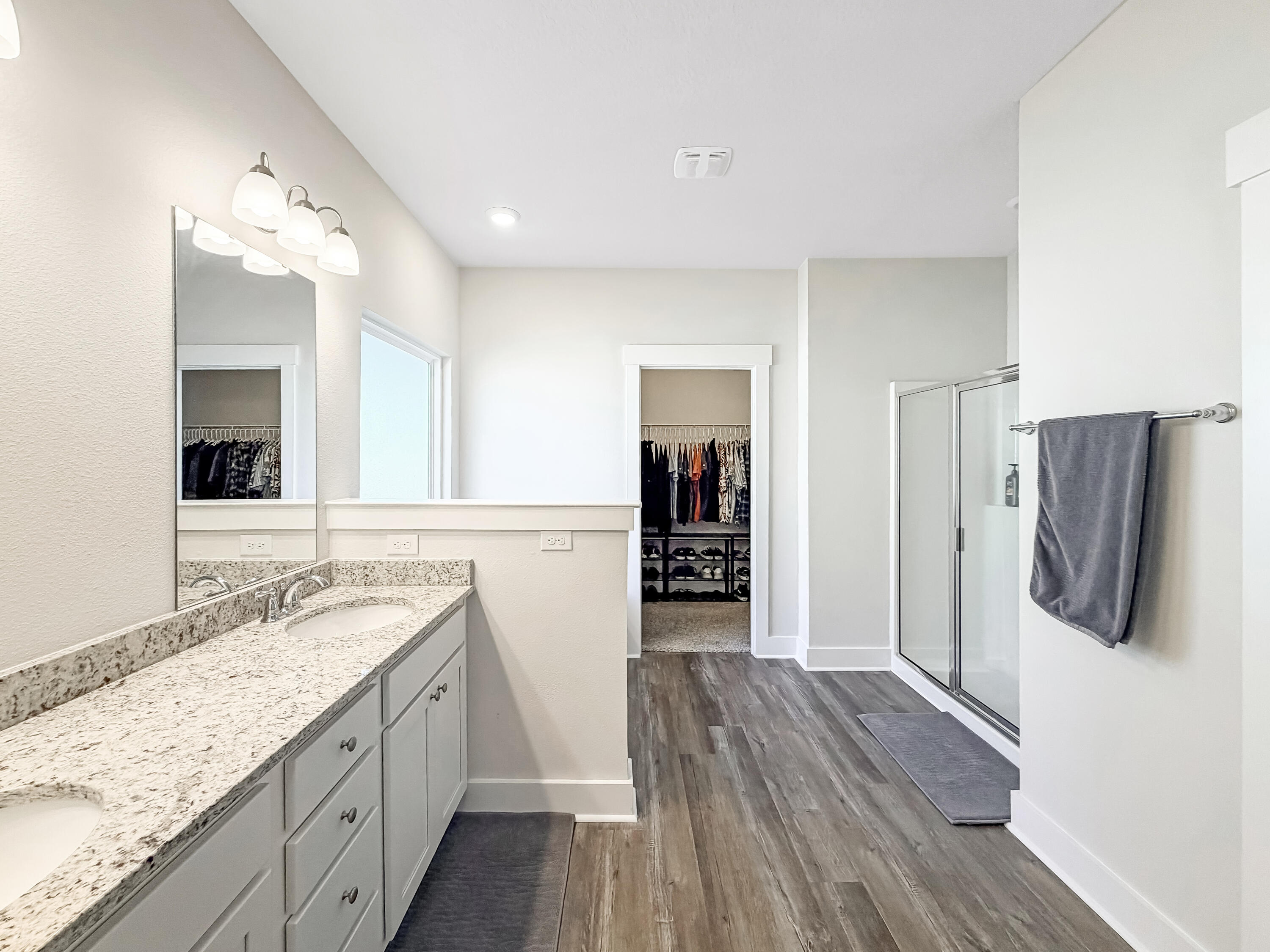 722 Quintana Street Crestview, FL 32539 - Photo 16 of 36 a spacious bathroom with a granite countertop sink and a mirror