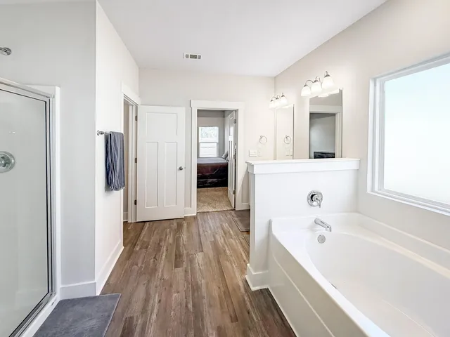 a view of walk in closet with clothes