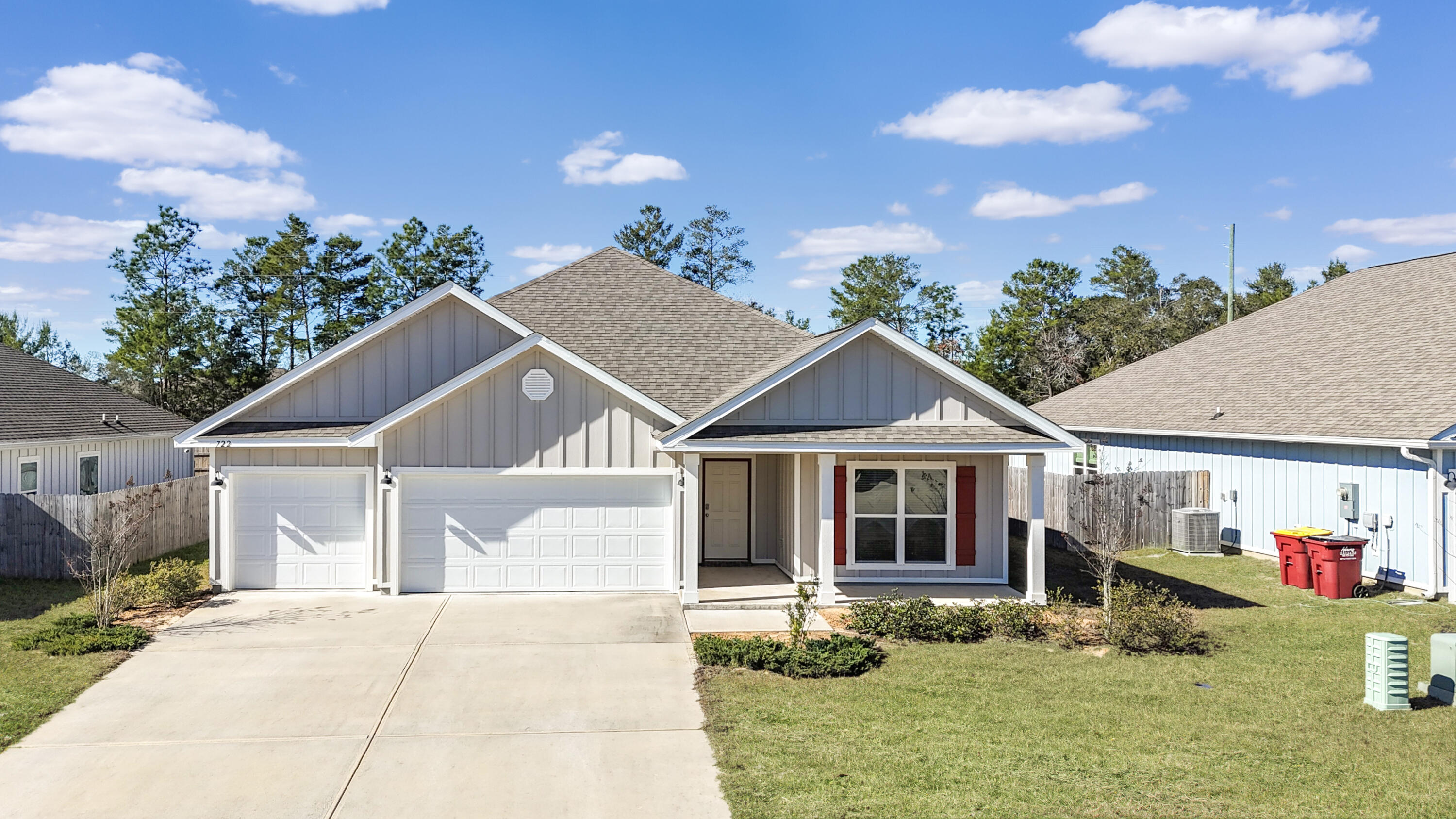 722 Quintana Street Crestview, FL 32539 - Photo 2 of 37 a front view of a house with garden