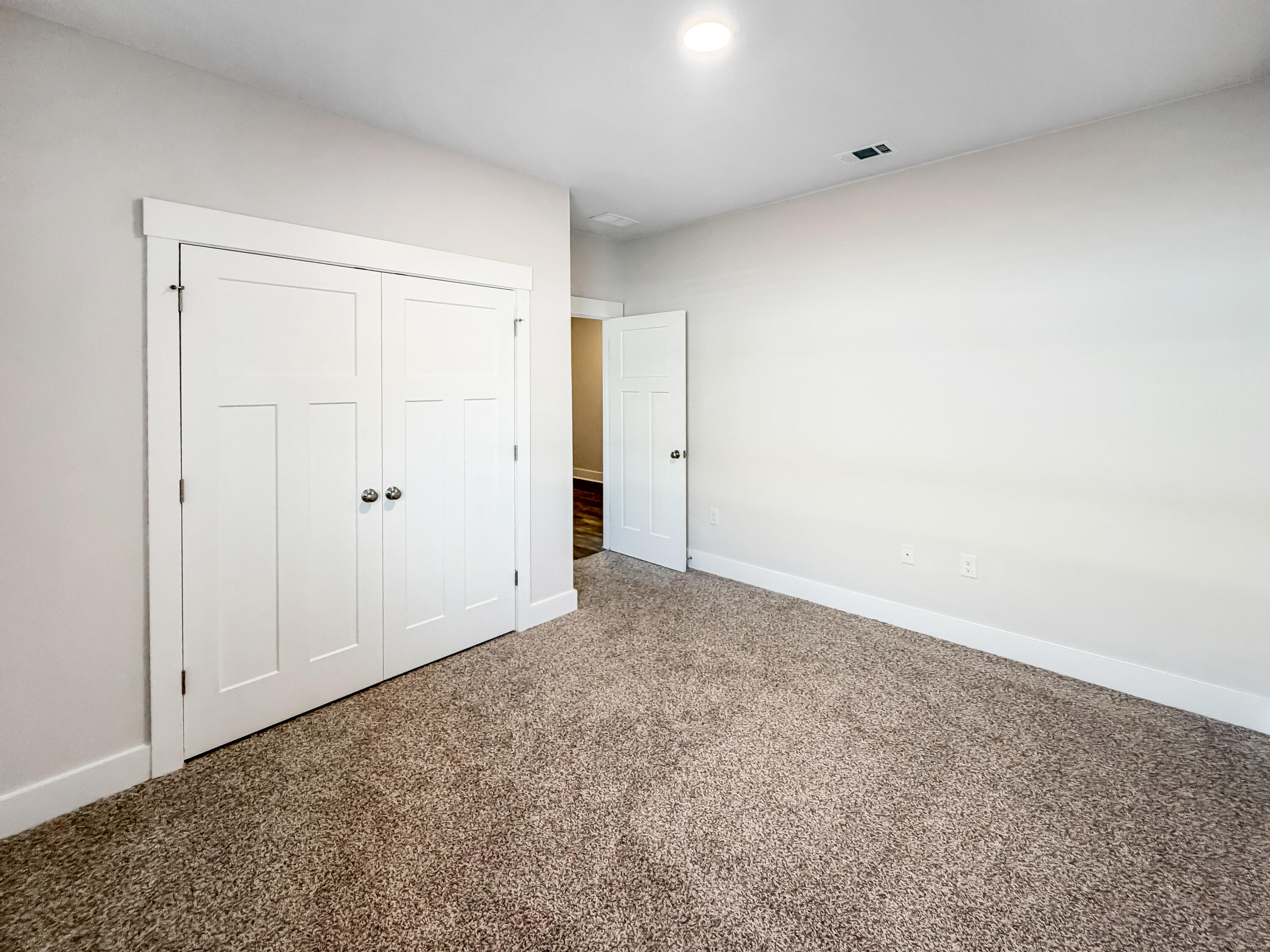 722 Quintana Street Crestview, FL 32539 - Photo 30 of 37 an empty room with a natural light