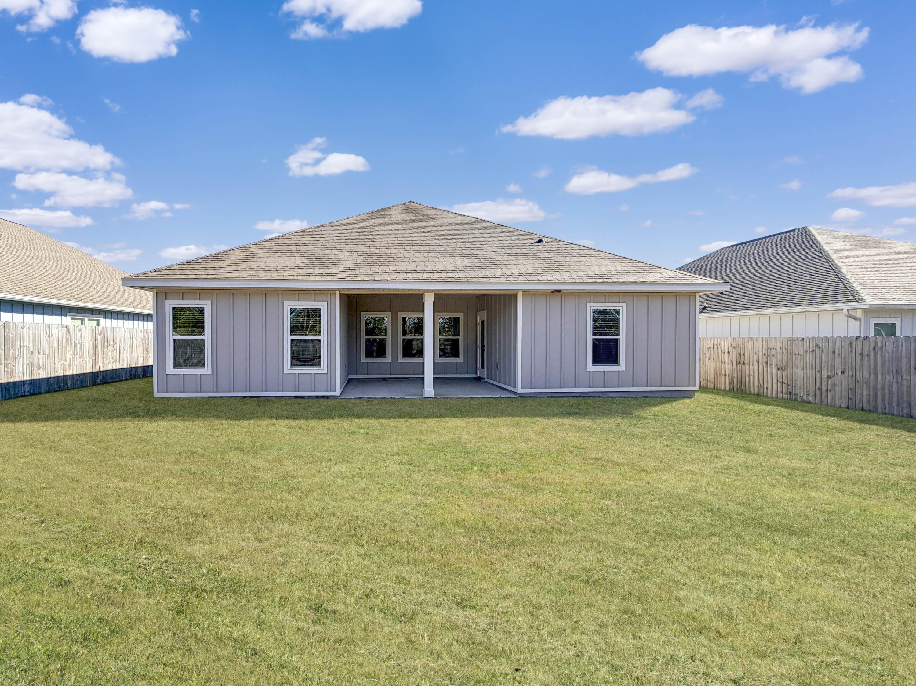722 Quintana Street Crestview, FL 32539 - Photo 33 of 36 a front view of a house with a garden