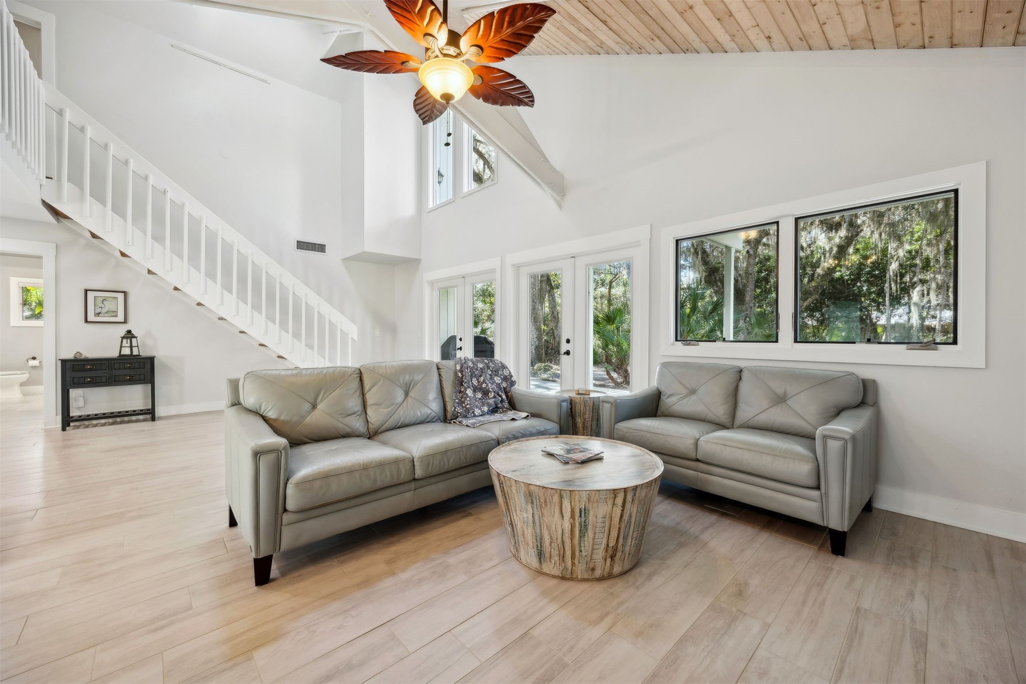 22 Beachwood Road Fernandina Beach, FL 32034 - Photo 16 of 100 a living room with furniture a ceiling fan and a large window