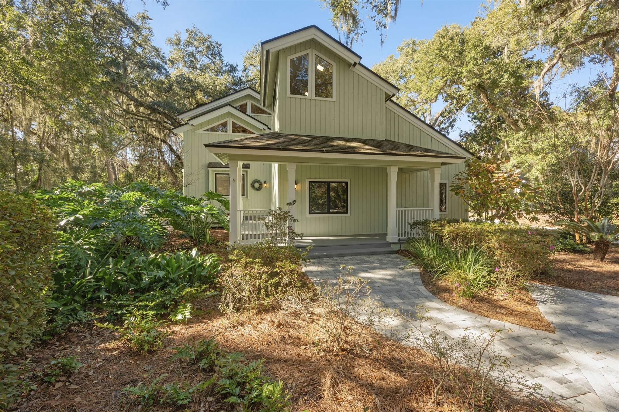22 Beachwood Road Fernandina Beach, FL 32034 - Photo 4 of 100 a view of a yard in front of a house with large trees