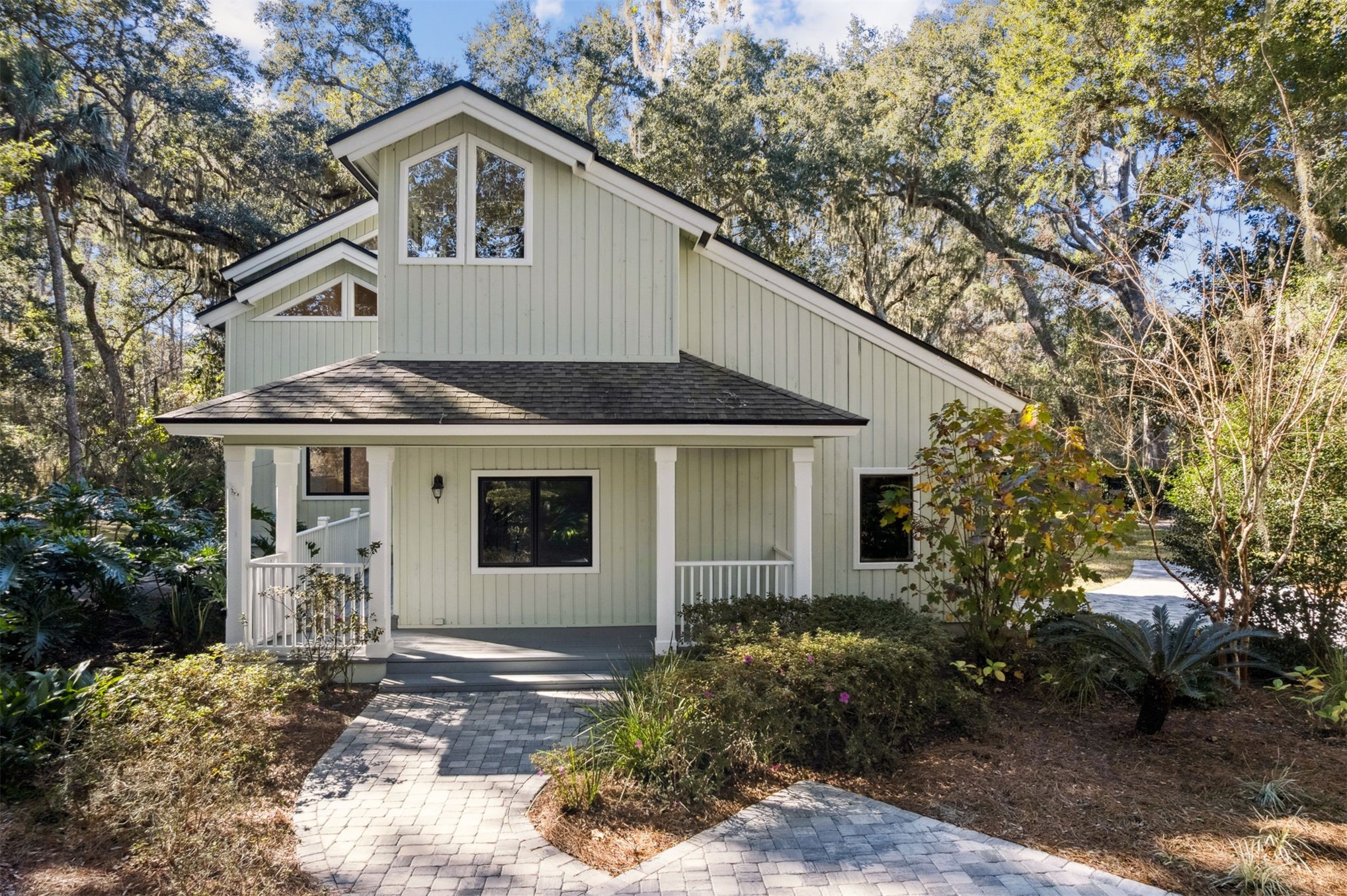 22 Beachwood Road Fernandina Beach, FL 32034 - Photo 77 of 100 a view of a white house with a yard and plants