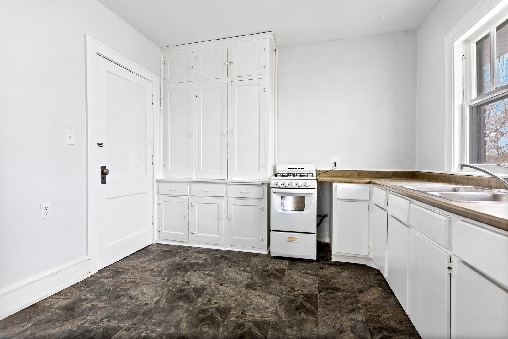 518 South Street Elgin, IL 60123 - Photo 11 of 22 a kitchen with white cabinets and white appliances