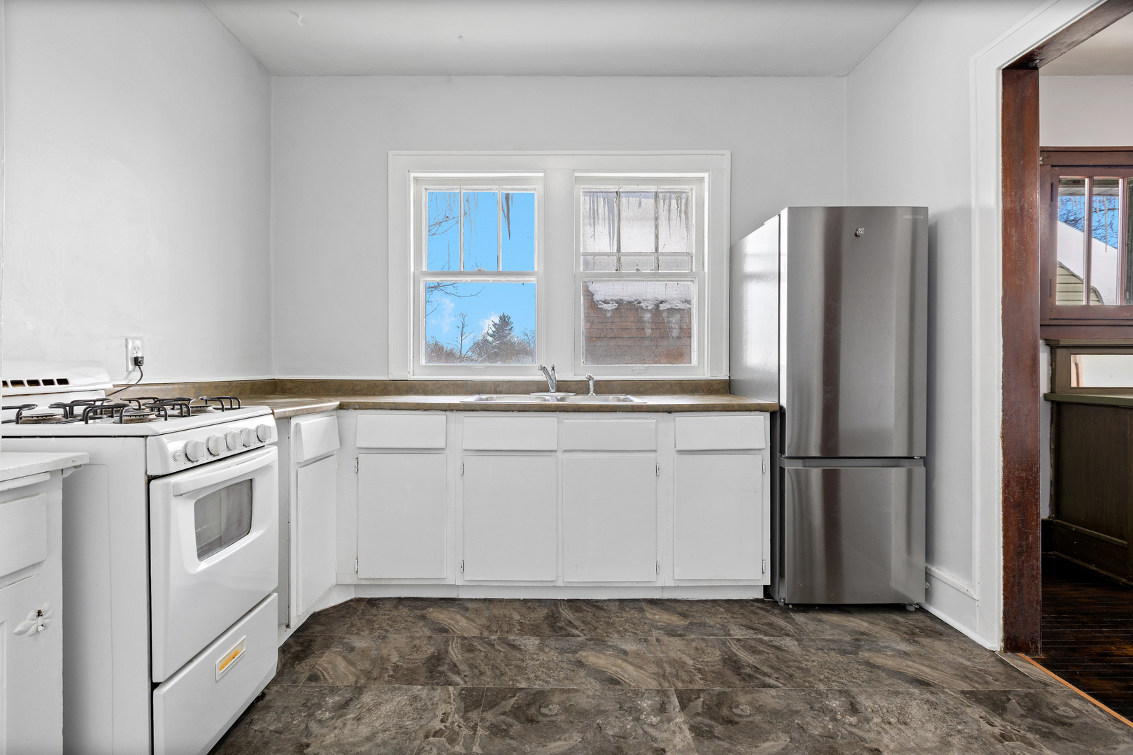 518 South Street Elgin, IL 60123 - Photo 13 of 22 a kitchen with stainless steel appliances granite countertop a refrigerator a stove and white cabinets