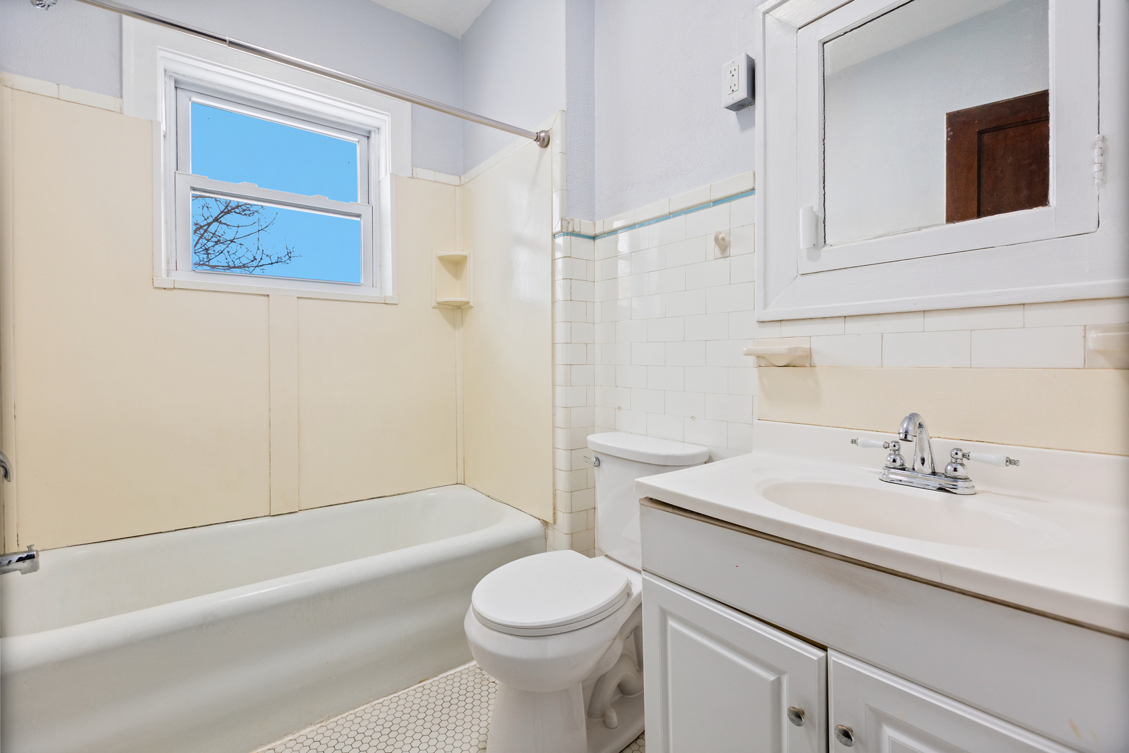 518 South Street Elgin, IL 60123 - Photo 16 of 22 a bathroom with a sink a toilet and shower