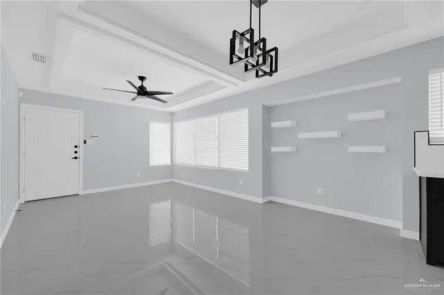 a view of an empty room with a window