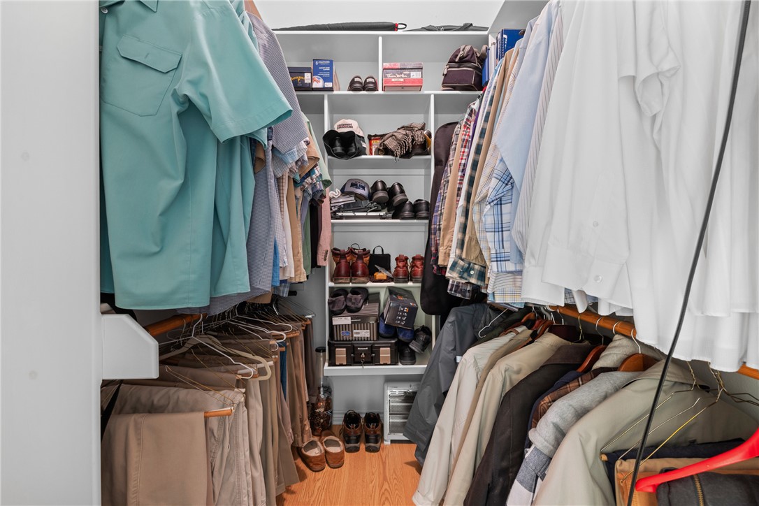 128 Duke Road Bedias, TX 77831 - Photo 25 of 49 a view of walk in closet with clothes and shoes