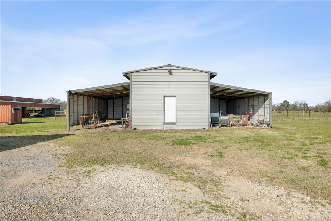 128 Duke Road Bedias, TX 77831 - Photo 41 of 49 a view of a house with a yard