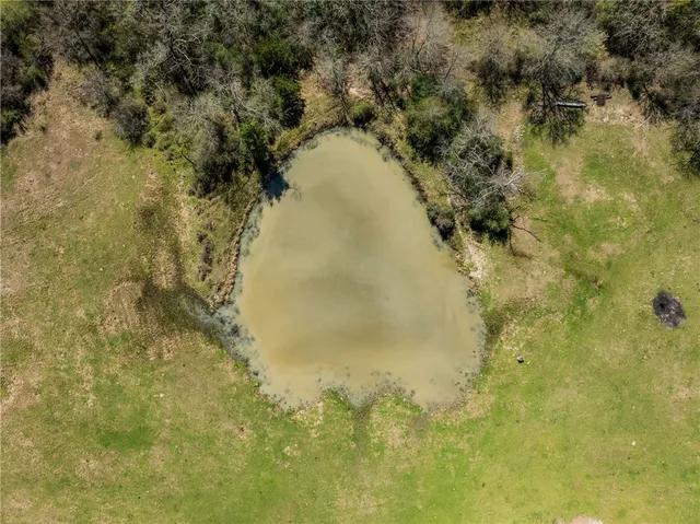 a view of a lake with houses in the back