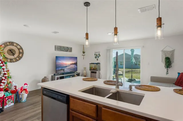 a kitchen with a sink and a refrigerator