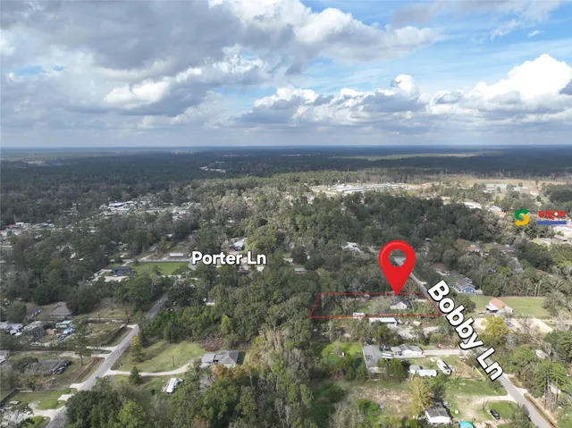 a view of a outdoor space with a swimming pool and valleys in the background