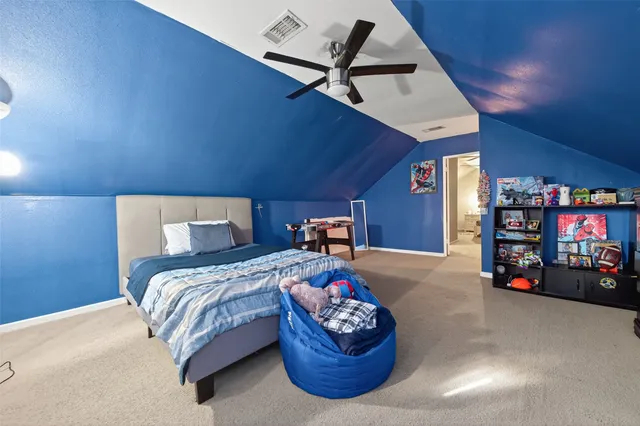 a bed room with a bed and a tv