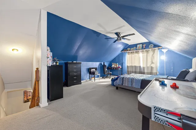 a bedroom with bed and a window