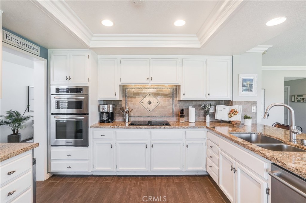 5 Lindall Street Laguna Niguel, CA 92677 - Photo 12 of 45 a kitchen with granite countertop white cabinets and white appliances