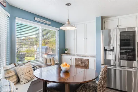 a dining room with furniture and window