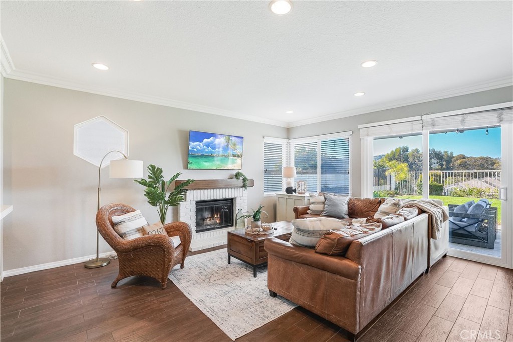 5 Lindall Street Laguna Niguel, CA 92677 - Photo 15 of 45 a living room with furniture large window and a fireplace