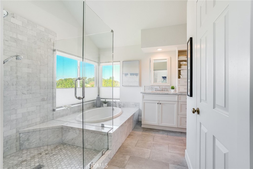 5 Lindall Street Laguna Niguel, CA 92677 - Photo 22 of 45 a bathroom with a granite countertop tub sink and mirror