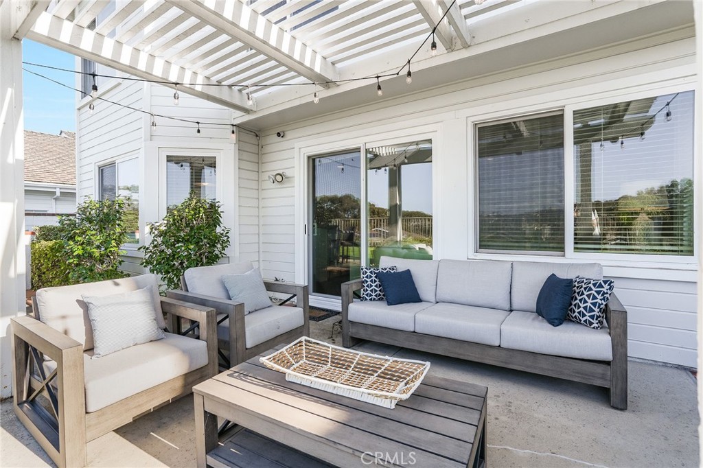 5 Lindall Street Laguna Niguel, CA 92677 - Photo 37 of 45 a view of a patio with couches chairs and wooden floor