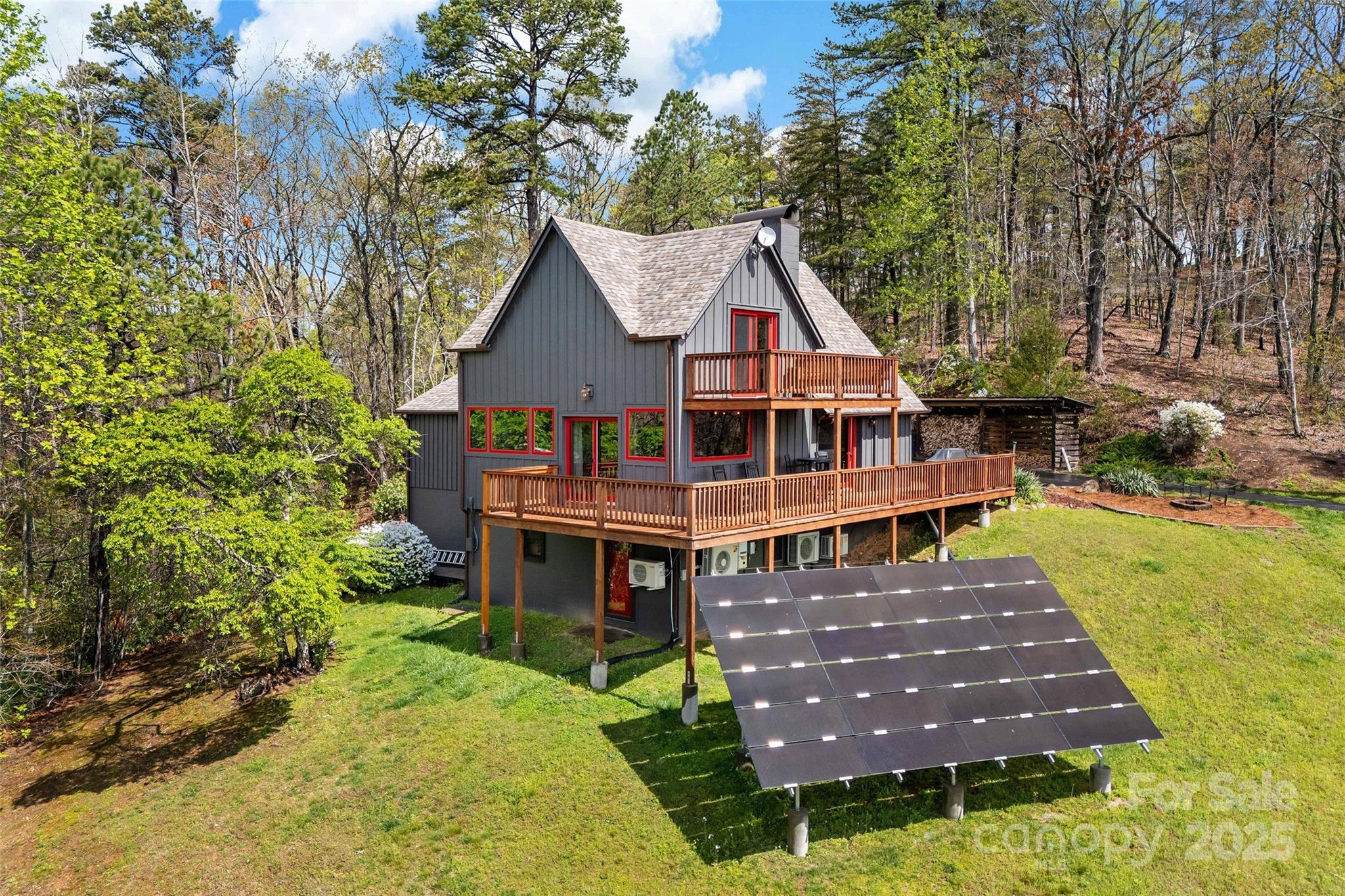 a view of a house with roof deck front of house